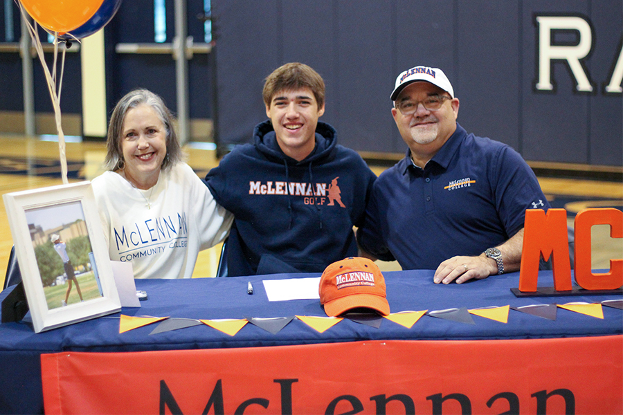 Senior Aiden Page signs his letter of intent for McClennan College to further his golf career.