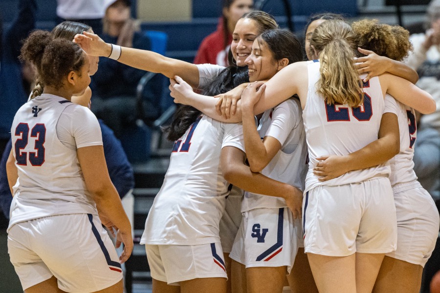 Winning against Boerne Champion,  the team embraces in a group hug of what was the seniors last time playing on their home court.