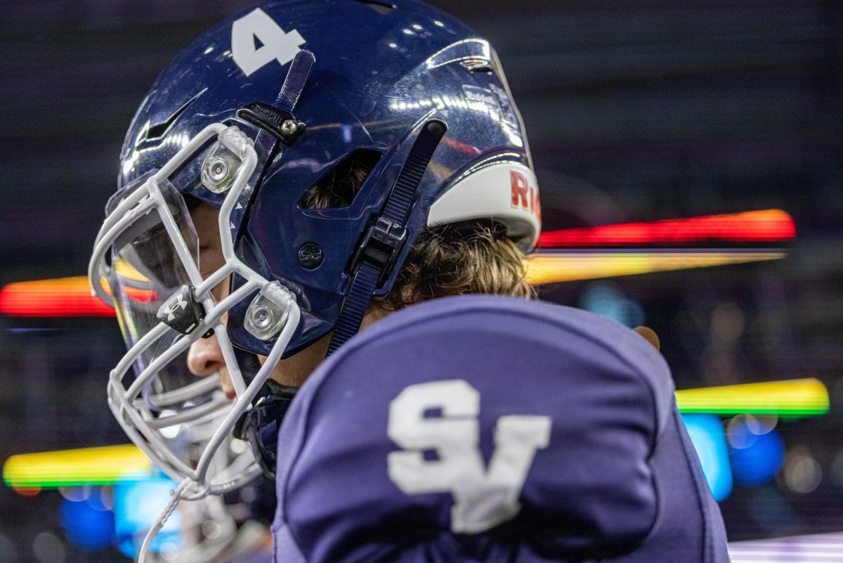 Senior Jackson Duffey watches from the sidelines at the state championship game on Dec. 15.