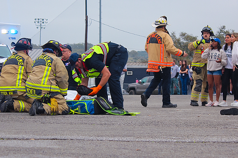 Local firefighters and EMS attempt to revive senior Maverick Minister during the Shattered Dreams presentation March 7. 