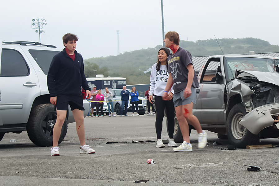 Senior Kannon Day yells at senior Ryder Bonser for driving while intoxicated during the Shattered Dreams presentation March 7. Day rode in the car that Bonser drove.