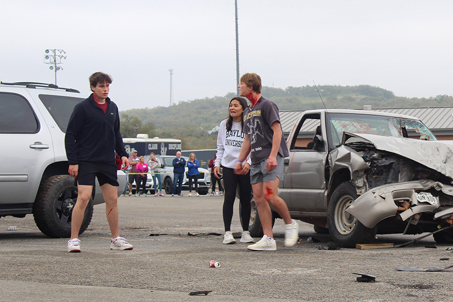 Senior Kannon Day yells at senior Ryder Bonser for driving while intoxicated during the Shattered Dreams presentation March 7. Day rode in the car that Bonser drove.