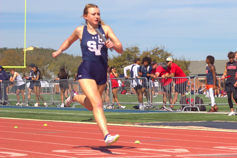 Junior Zailey Zimmerman crosses the finish line at the Ranger Relays.