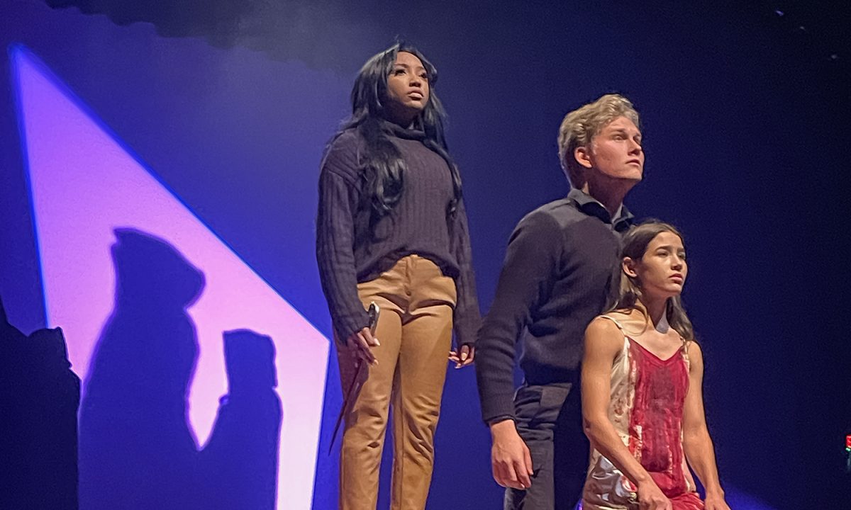 Seniors Victoria Williams and Rowen Hamilton and junior Evie Armour perform the ending scene of the One Act play "Iphigenia" at the Founder's Day celebration April 10.