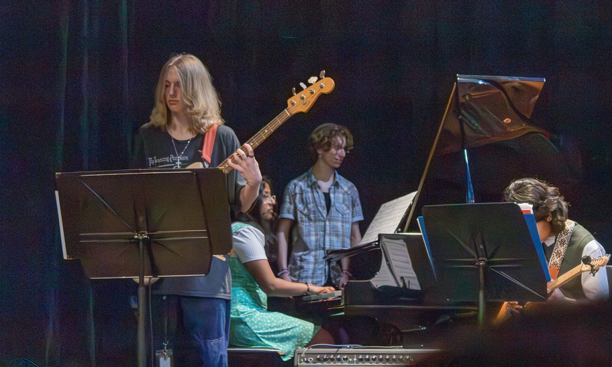 Freshman Jaxon Smith plays the bass with the Jazz band at the Founder's Day celebration April 10 during advisory.