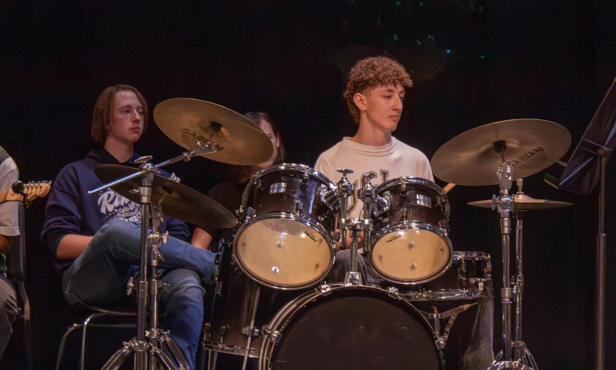 Junior Braeden Wills plays the drums during the Jazz band's performance at the Founder's Day celebration April 10.