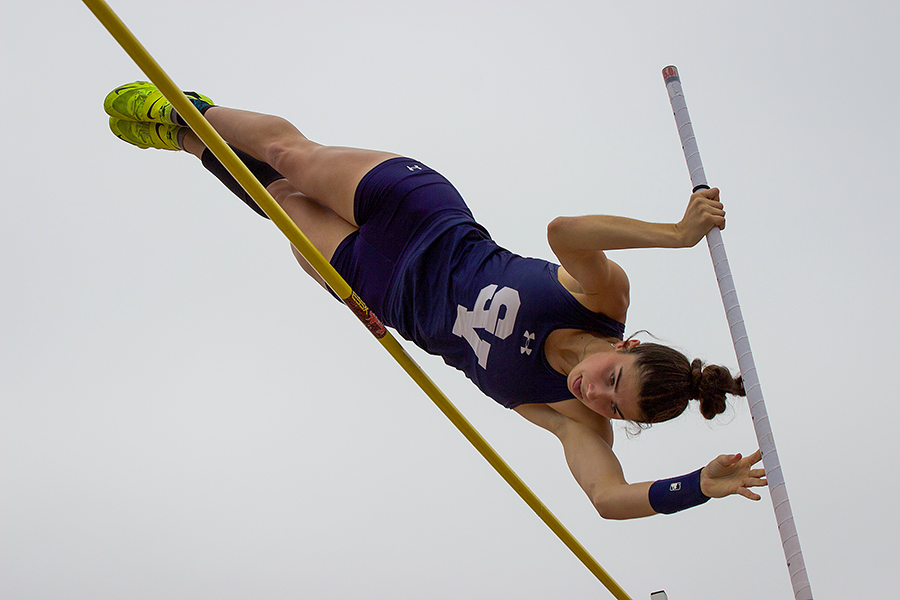 Senior Ella Pickron pole vaults at a track meet earlier this season.