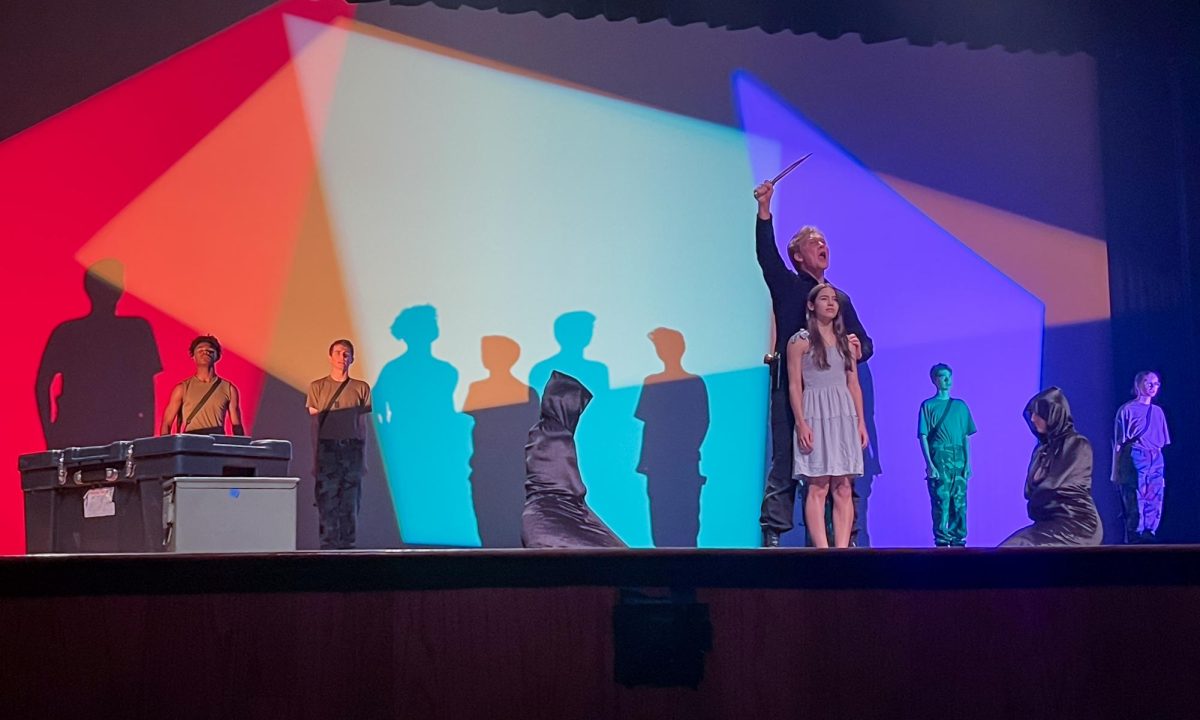 Senior Rowen Hamilton and junior Evie Armour perform an ending scene in the theater department's One Act play "Iphigenia" at the Founder's Day celebration.