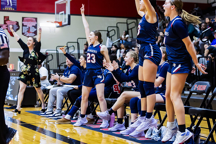 The teams' bench celebrates as a three pointer is made against Wagner on Dec.20