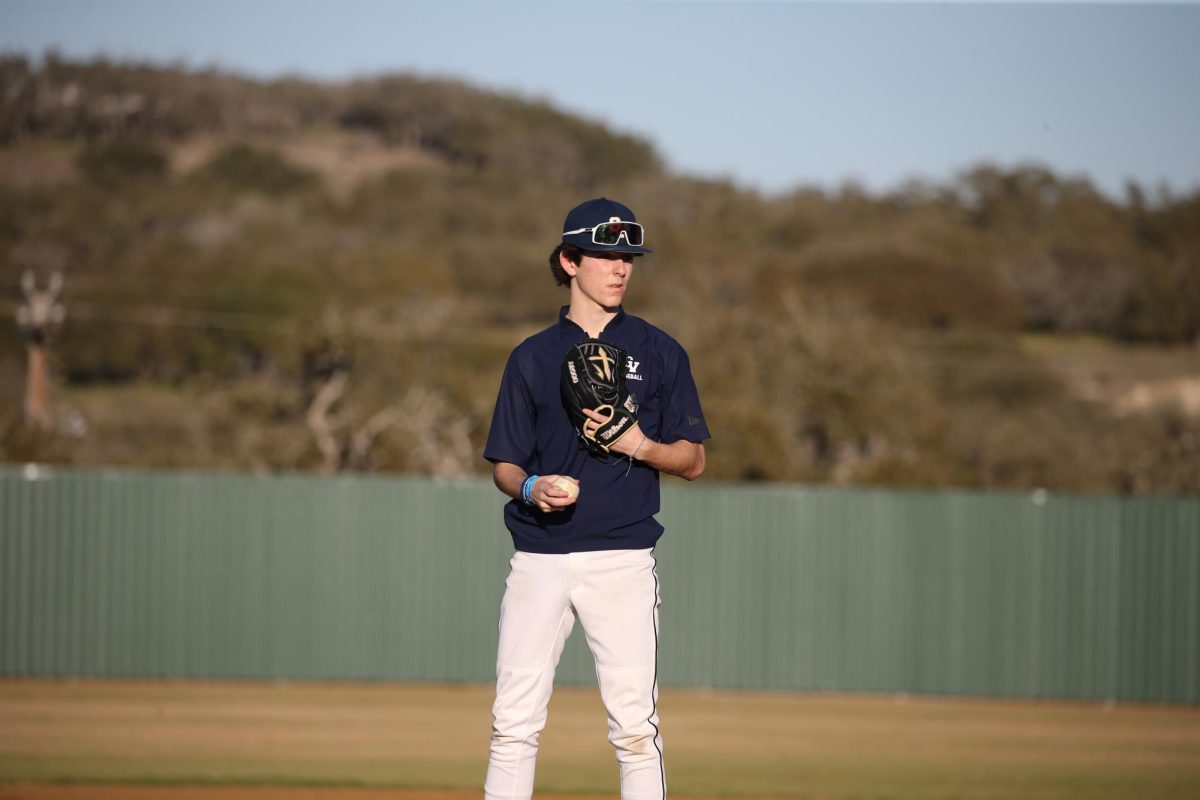 Junior Nick Miller stands on the pitcher's mound at the first baseball practice.