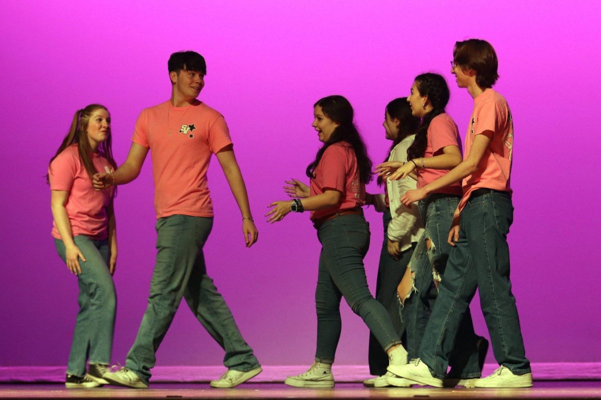 Senior Lukas Haider and other members of student council perform an opening skit for the talent show of Feb. 27.