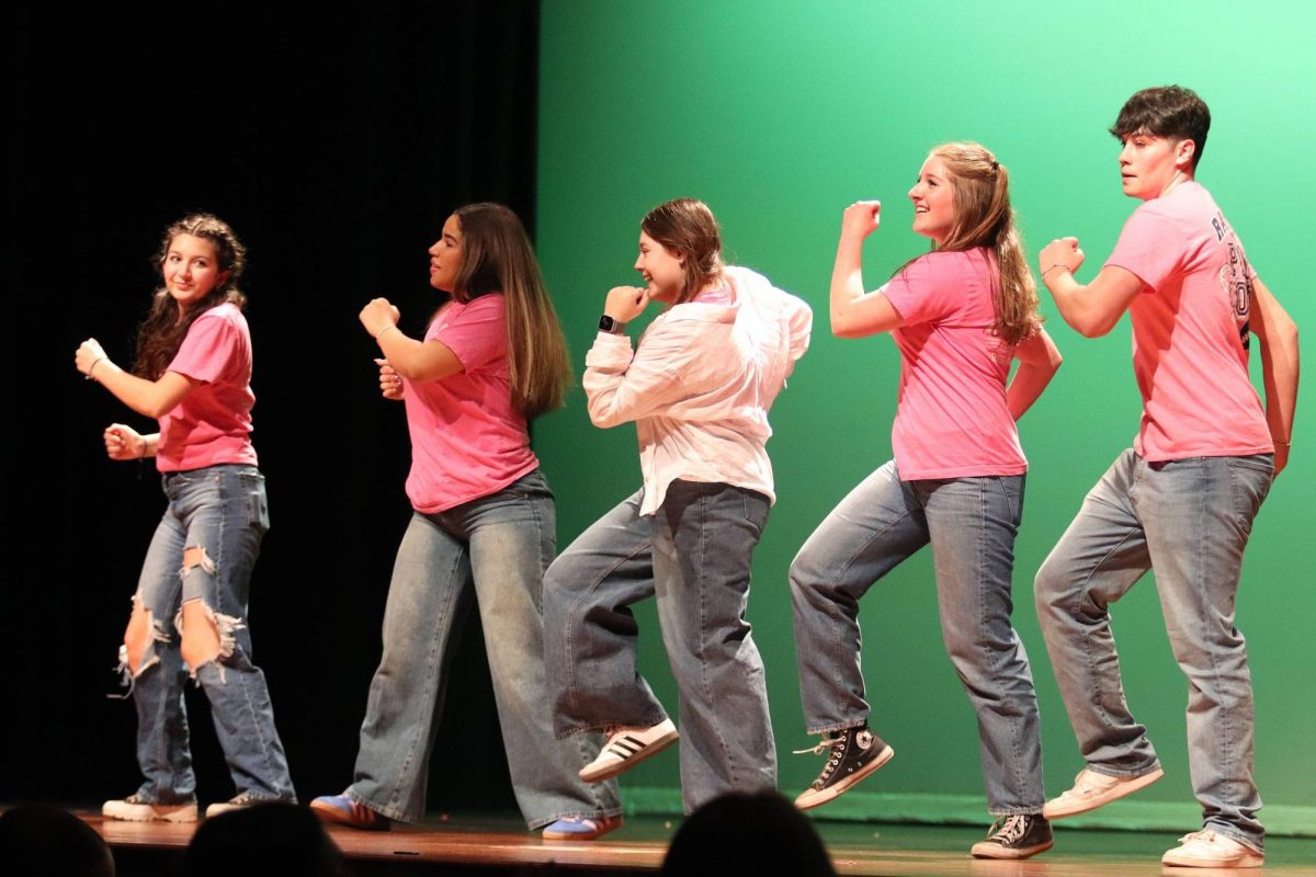 Members of student council dance to the Dance Central choreography to "Poison" by Bell Biv DeVoe.
