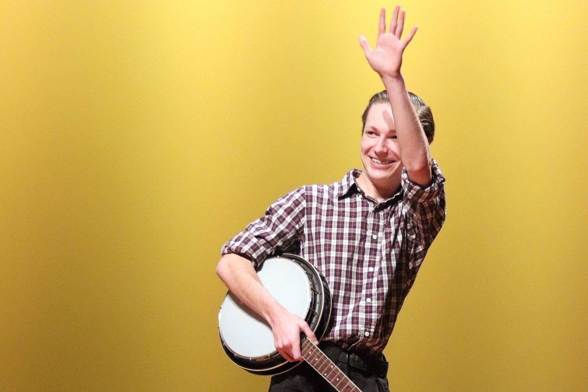 Senior Jack Ruston thanks the crowd as he leaves the stage after performing at the talent show.