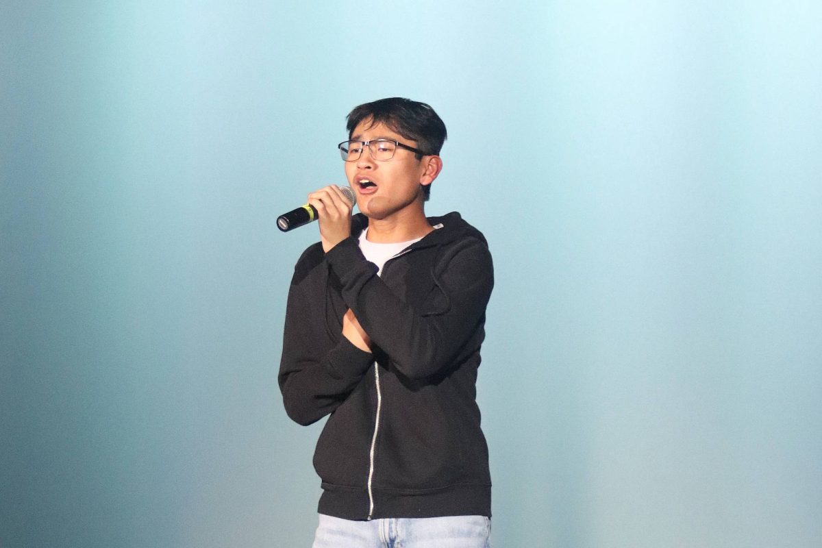 Freshman Jaiden Manrique sings a solo at the talent show Feb. 27.
