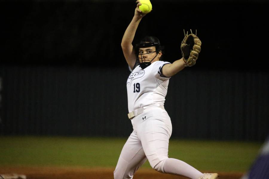 Senior pitcher, Arianna Capek, pitches against her opponent on Friday nights home game against Boerne.