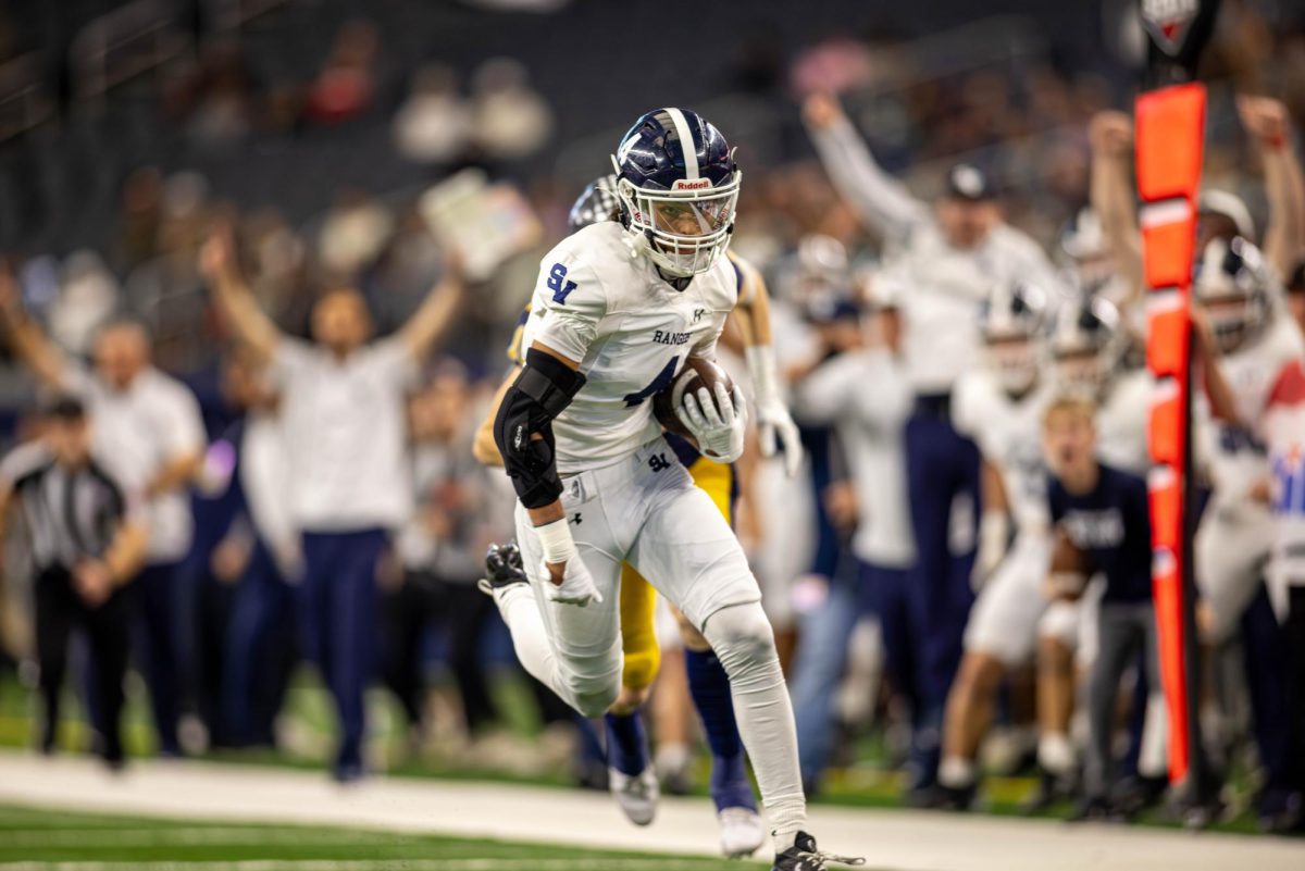Graduate Julian Colunga runs into the end zone after intercepting the ball from Highland Park at the end of the first quarter. 