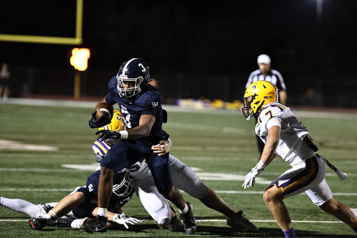 Junior running back Caleb Peagler breaks a tackle to gain crucial yards for the Rangers.